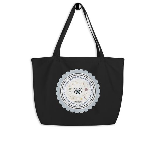 Black organic tote bag with a circular design featuring text 'You are the universe experiencing itself' and symbols on a white background
