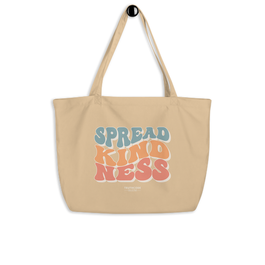 Beige organic tote bag with 'Spread Kindness' text on a white background