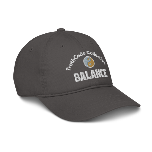Dark gray cap with 'TruthCode Collective' and 'Balance' text with yin yang design, on a white background