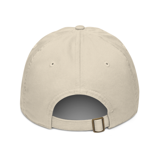 The back of a beige cap showing adjustable strap