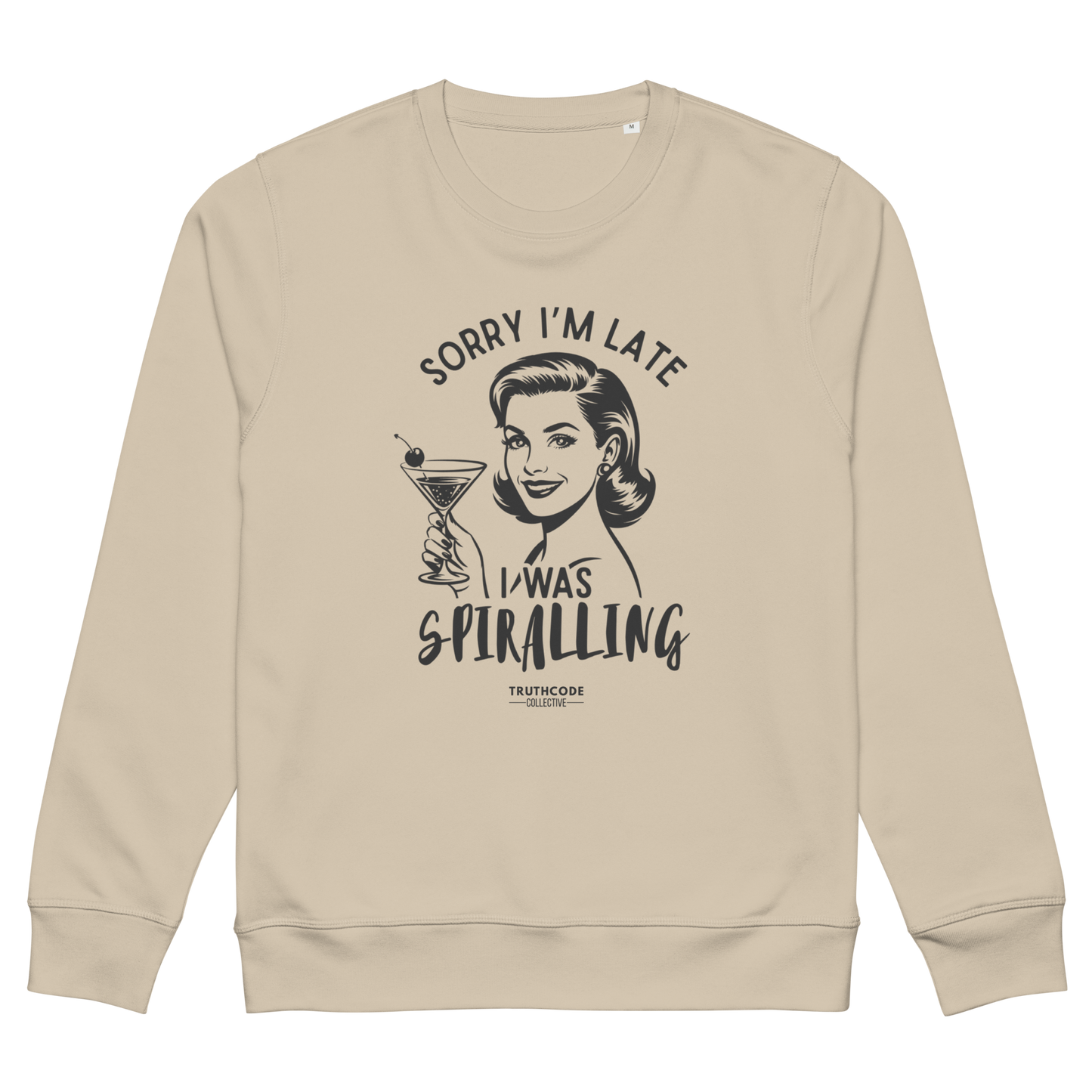 Beige organic sweatshirt with vintage style graphic design of woman holding a martini glass and text 'Sorry I'm late I was spiraling', on a white background