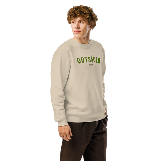 Guy wearing beige organic sweatshirt with 'OUTSIDER' text and evergreen tree graphic on a white background