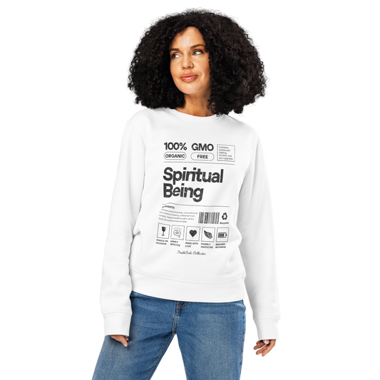Woman wearing white organic sweatshirt with text 'Spiritual being' and graphics resembling a laundry tag on a white background