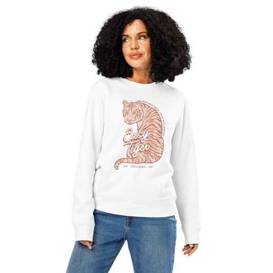 Woman wearing white organic sweatshirt with a tiger graphic and 'Easy Tiger' text, on a white background