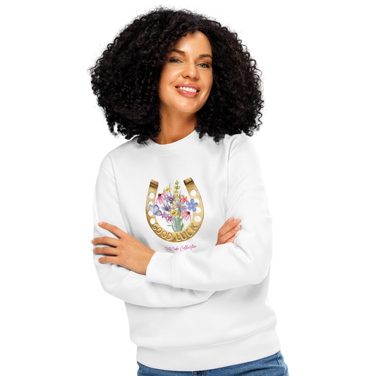 Woman wearing white organic sweatshirt with a floral and horseshoe design and text 'GOOD LUCK' on a white background