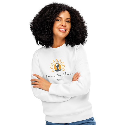 Woman wearing white organic sweatshirt with a flower design with person meditating design and 'born to flow' text on a white background