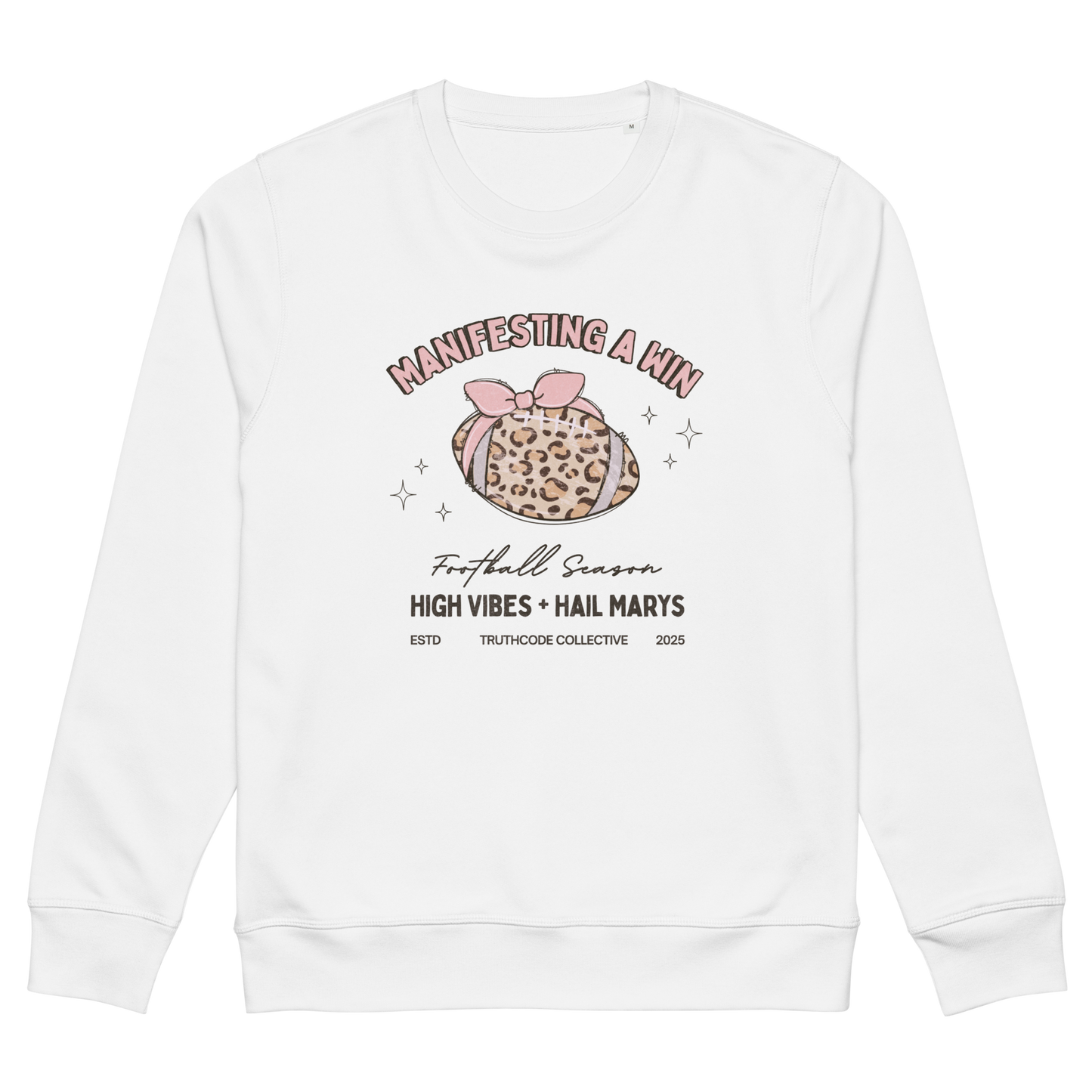 White organic sweatshirt with girly football graphic design and text 'Manifesting a win, high vibes and hail marys' on a white background