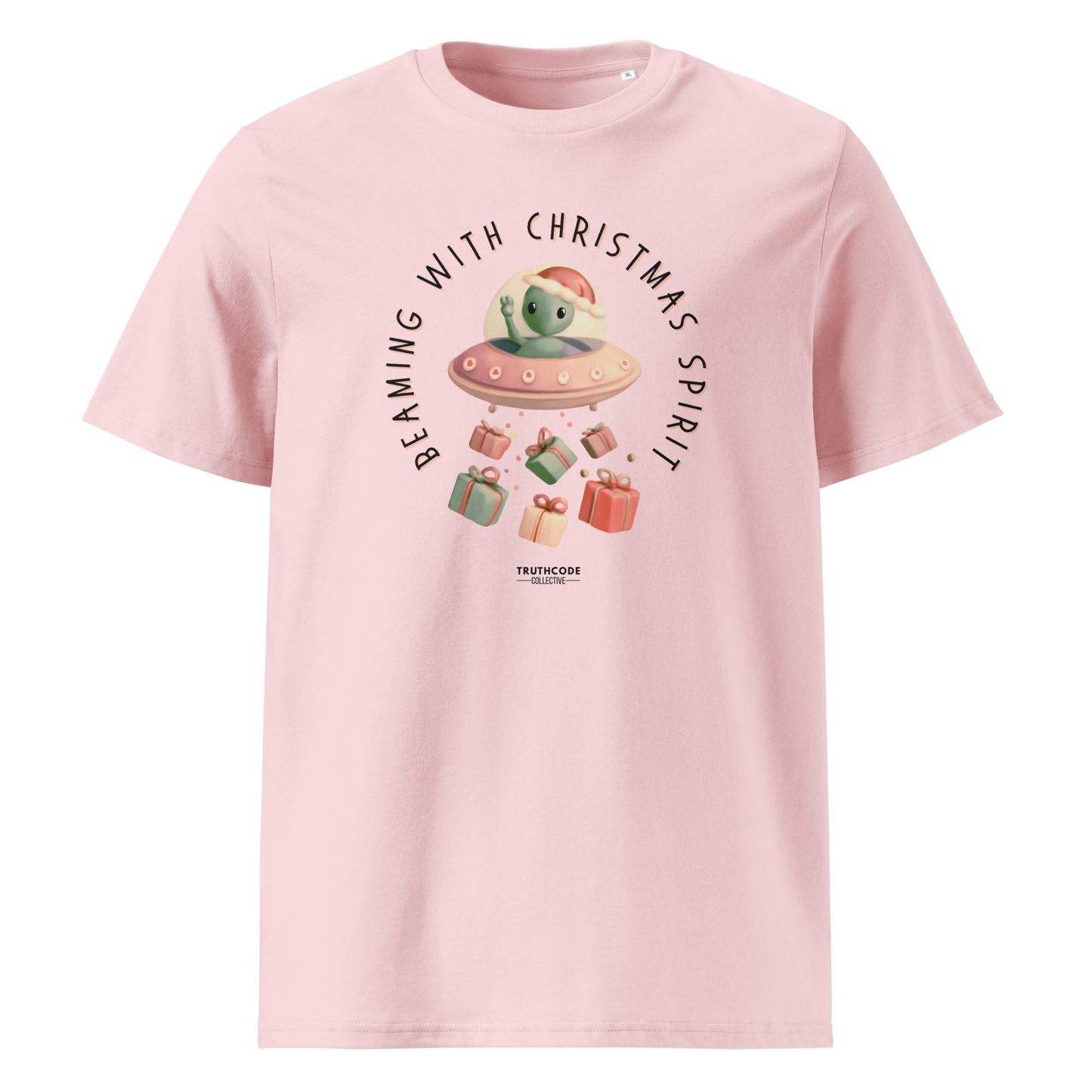 Pink organic t-shirt with Christmas- themed alien graphic and text 'Beaming with Christmas spirit' on a white background