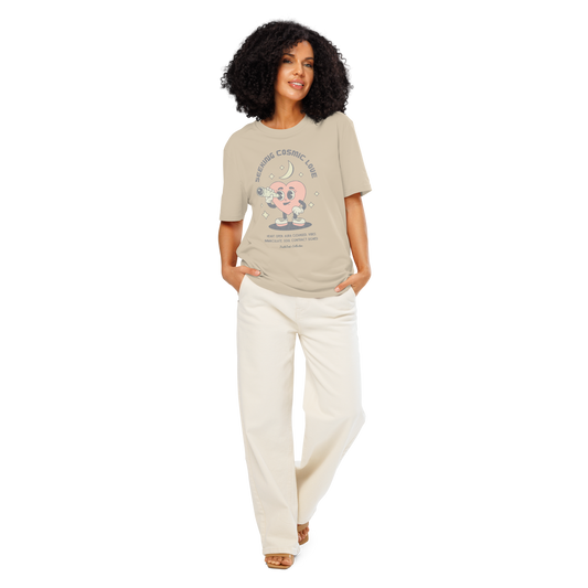 Women wearing beige organic t-shirt with a heart-shaped character holding a telescope and text 'Seeking Cosmic Love' on a white background.