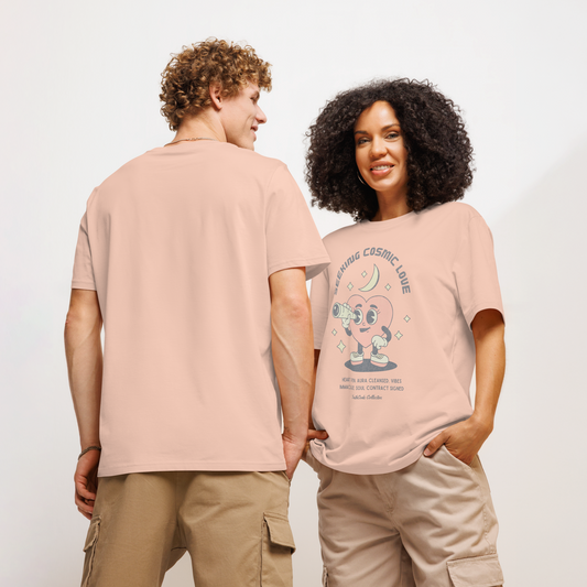 Models wearing peach organic t-shirt with a heart-shaped character holding a telescope and text 'Seeking Cosmic Love' on a white background