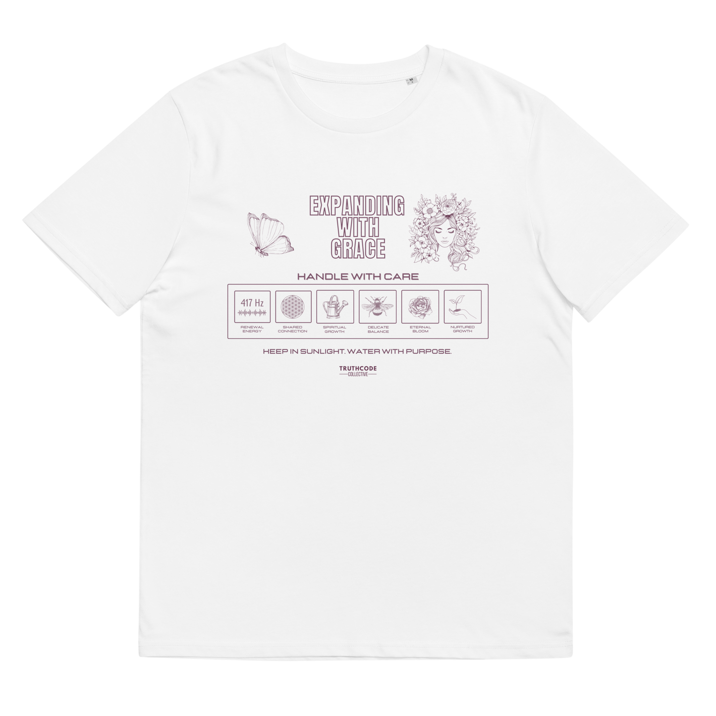 White organic t-shirt with text 'Expanding with grace' and symbols relating to expanding in laundry tag style graphics on a white background