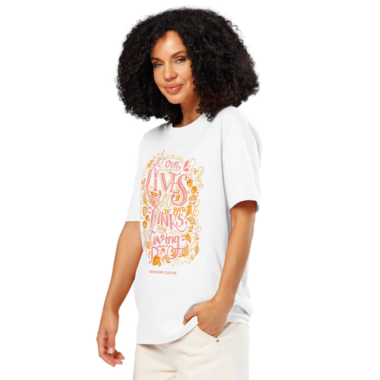 Woman wearing white organic t-shirt with colorful text design 'Let our lives be full of both thanks and giving' on a white background