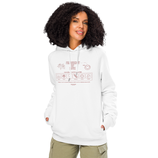 Woman wearing white organic hoodie with text 'Frequency of love' with symbols and graphics relating to it on a white background