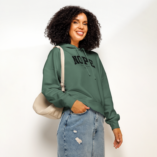 Woman wearing green organic hoodie with 'NOPE NOT TODAY' text design on a white background