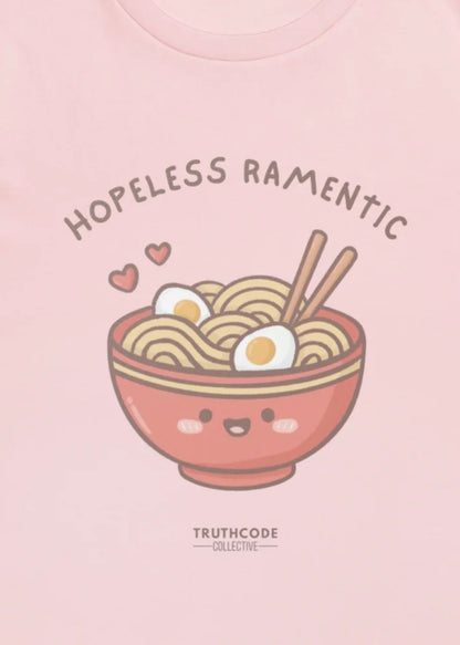 Close view of pink t-shirt with a bowl of ramen, chopsticks, and text 'Hopeless Ramentic' 