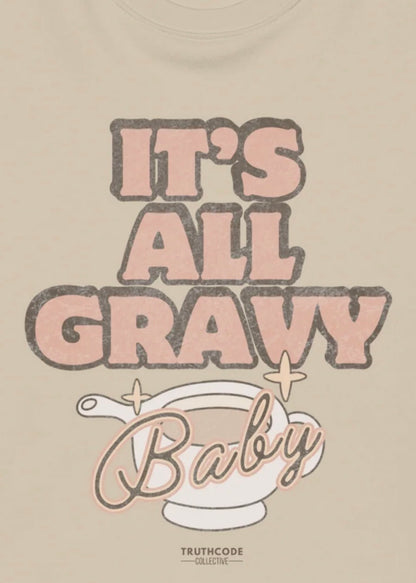 Close view of beige t-shirt with 'It's All Gravy Baby' text and a gravy boat graphic, on a white background