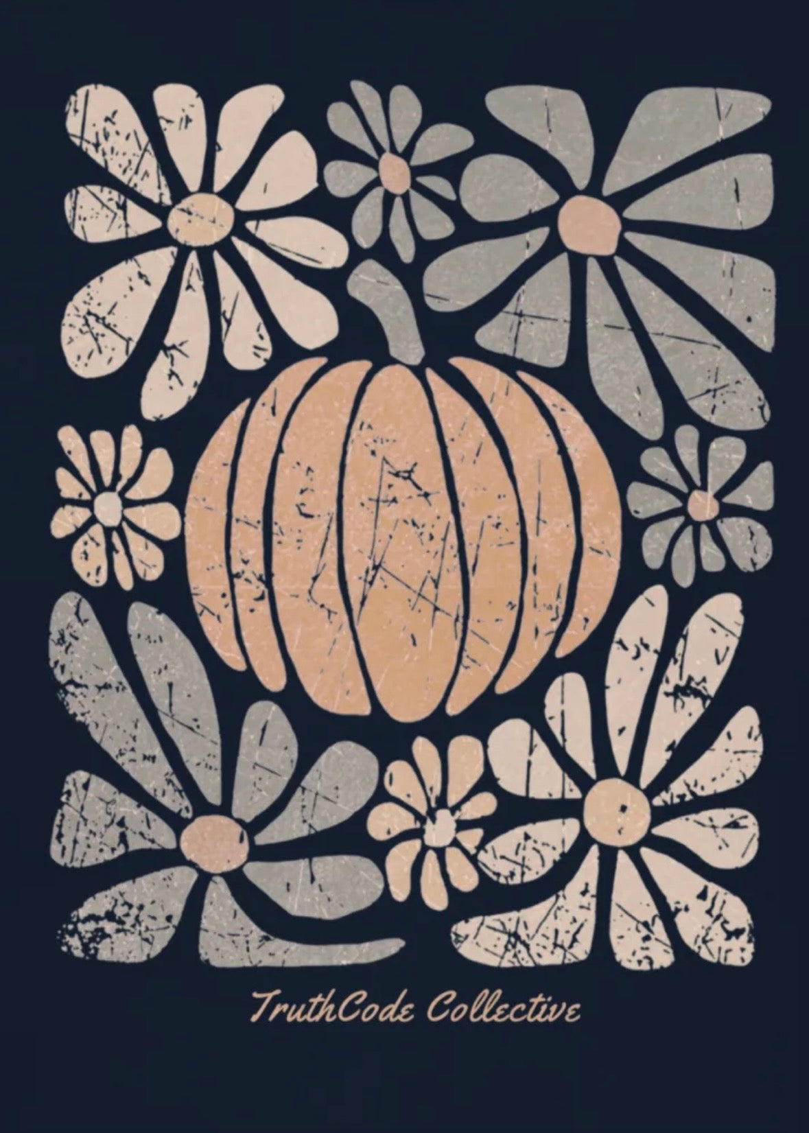 Decorative fall design with a pumpkin and stylized flowers on a navy blue sweatshirt background, featuring the 'TruthCode Collective' brand.