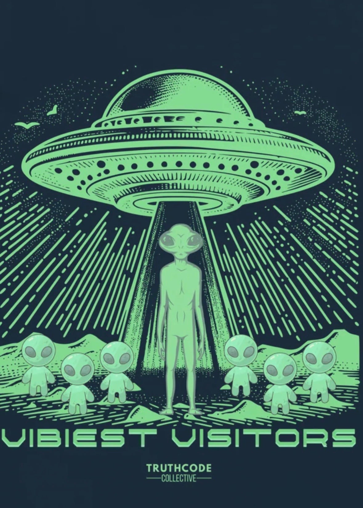 Close view of navy blue t-shirt with alien abduction scene with green UFO and aliens on a dark background, with text 'Vibiest Visitors' 