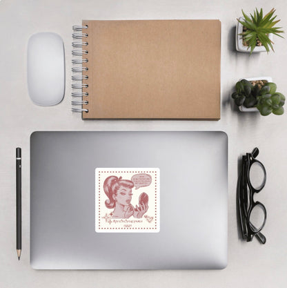 Arial view of desk with accessories and laptop featuring square sticker of a vintage style illustration of a woman applying makeup with a humorous text bubble 'I have selective hearing. I'm sorry you were not selected' and '#protectyourpeace'