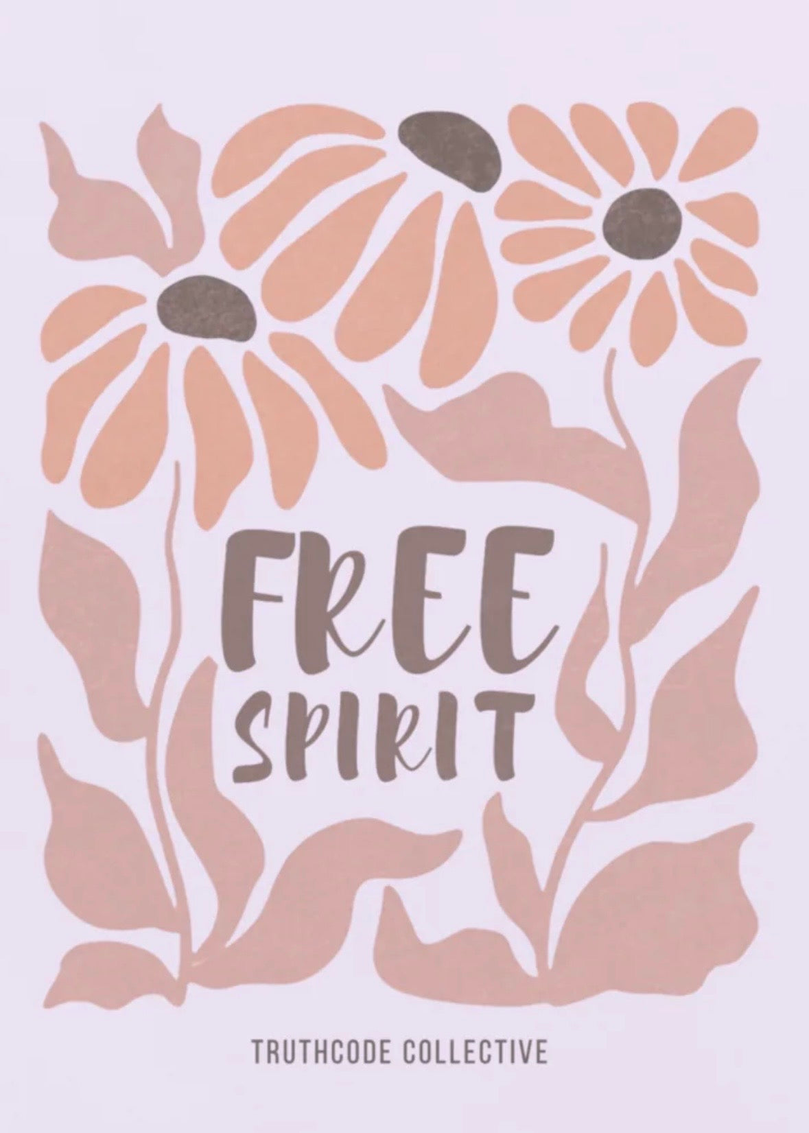 Close view of lavender organic t-shirt with pink floral design and 'Free Spirit' text, on a white background