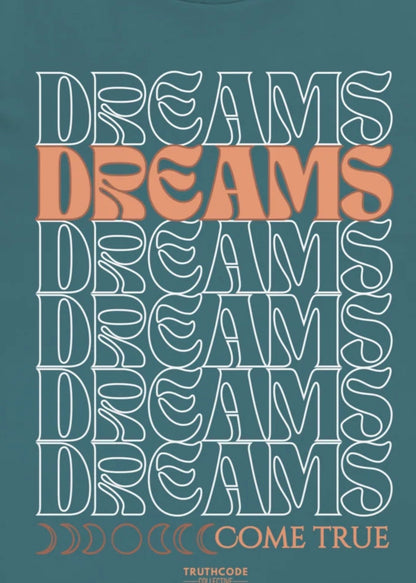 Close view of teal tee with text design 'DREAMS COME TRUE' on a teal background