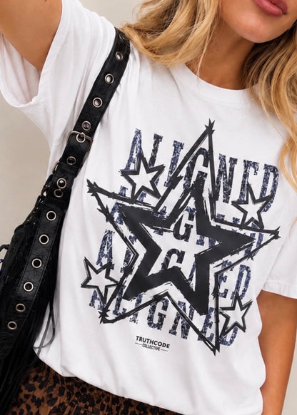 White t-shirt with black star graphic and text, worn by a person. Text says ALIGNED