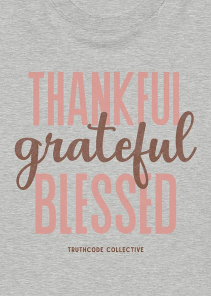 Gray sweatshirt with 'Thankful grateful blessed' text and Truthcode Collective logo.
