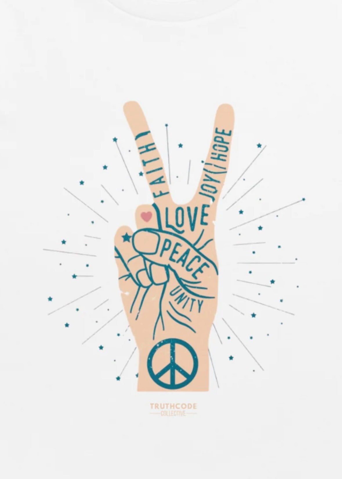 Close view of white t-shirt of hand making a peace sign with wording on the hand 'Peace, unity, love, faith, joy, hope.'