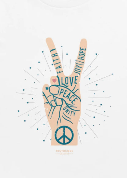 Close view of white t-shirt of hand making a peace sign with wording on the hand 'Peace, unity, love, faith, joy, hope.'