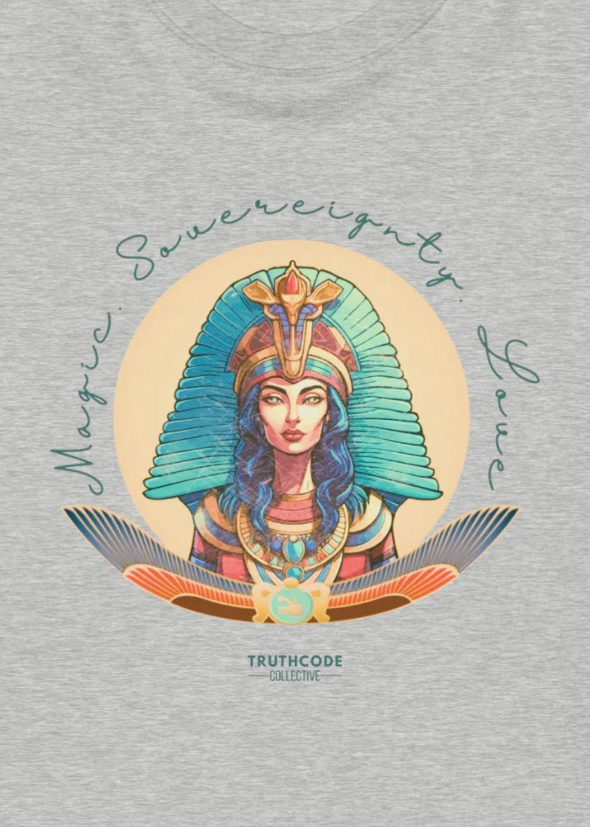 Gray sweatshirt with a colorful Isis Egyptian-style design and 'magic, sovereignty, love' text on a gray background