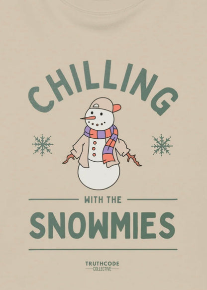Close view of beige t-shirt with a snowman graphic and text 'Chilling with the Snowmies' 