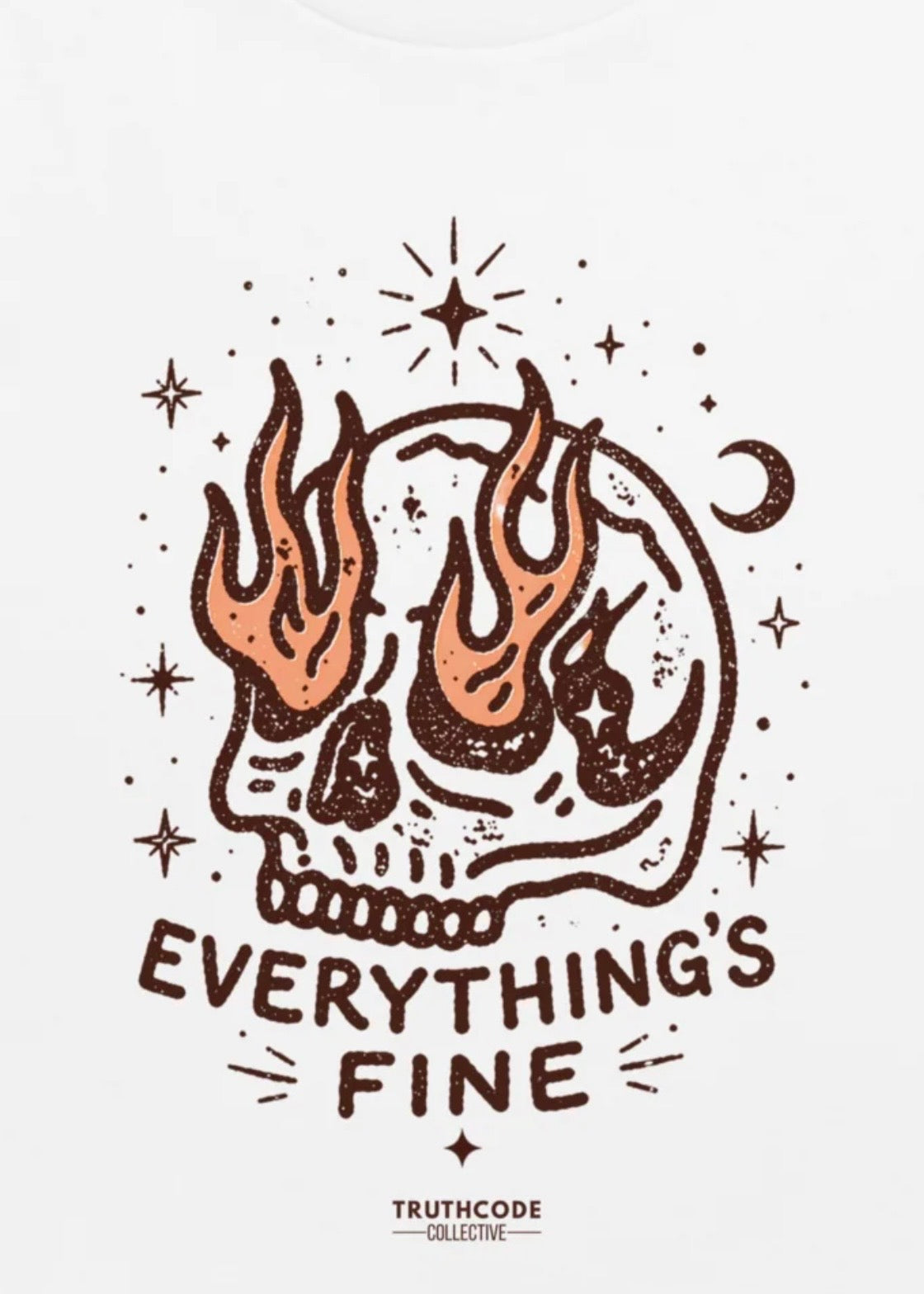 Close view of white organic t-shirt with graphic of skeleton with flames coming out of the eye sockets and text 'Everything is fine' against a white background