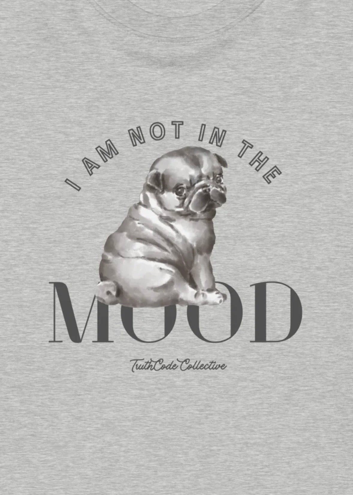 Close view of gray sweatshirt with a pug graphic design and text 'I am not in the mood' 