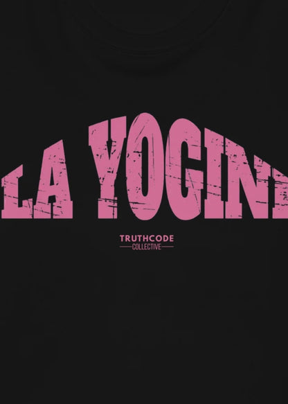 Close view of black sweatshirt with pink 'LA YOGINI' text and 'Truthcode Collective' 