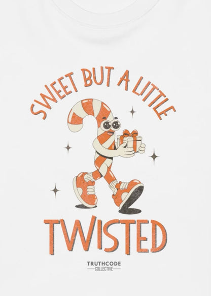 Close view of white t-shirt with cartoon character with candy cane holding a gift, text 'Sweet but a little twisted' 