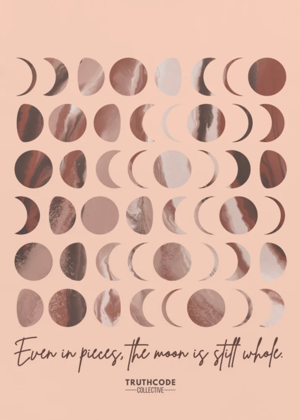 Close view of peach t-shirt with pattern of moon phases and text 'Even in pieces, the moon is till whole'