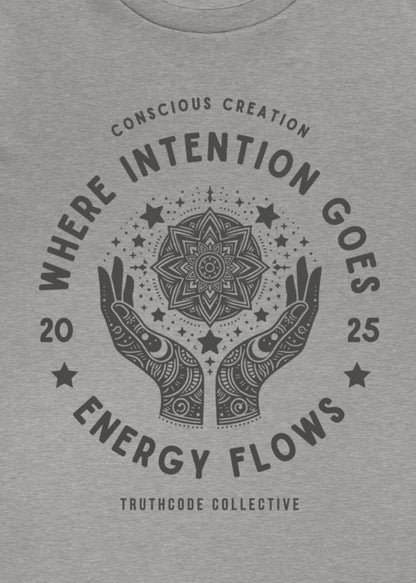 Close view of a gray t-shirt with mandala design and text 'Where intention goes, energy flows' 