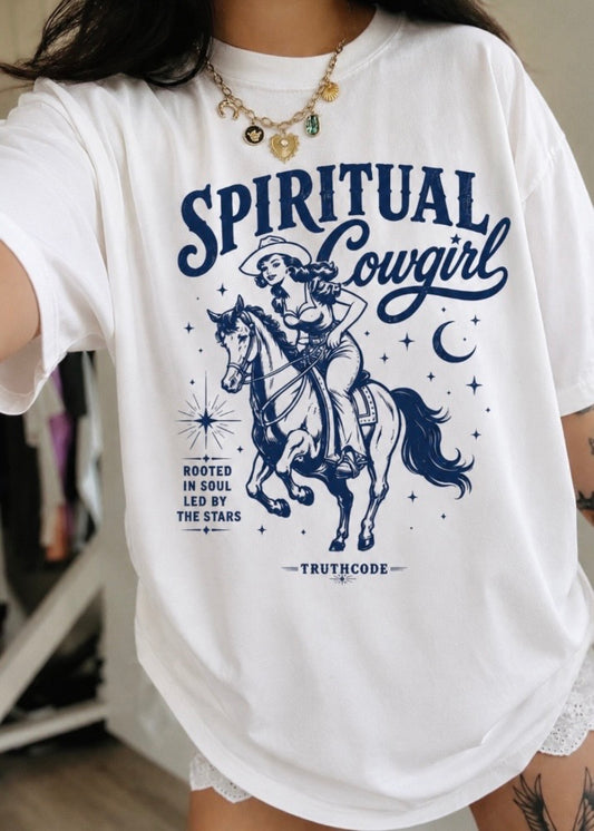 White t-shirt with 'Spiritual Cowgirl' graphic design featuring a cowgirl on a horse.