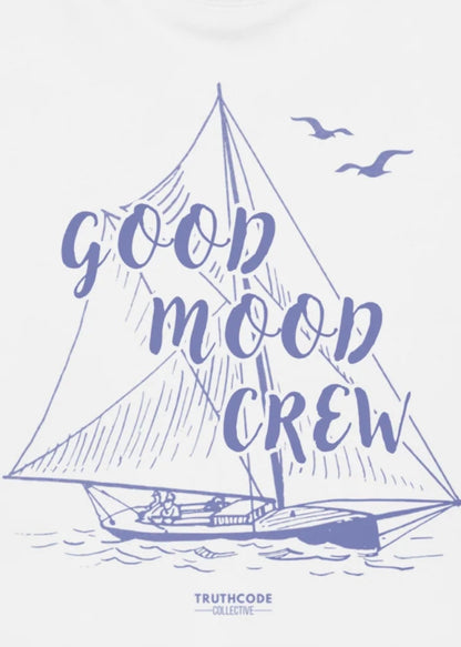 Close view of white t-shirt with graphic of a sailboat illustration and text 'Good Mood Crew' 