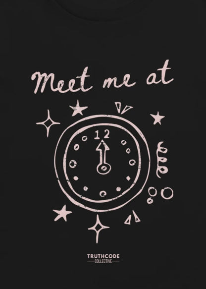 Close view of black t-shirt with white clock design and text 'Meet me at' and the clock showing midnight for the time.