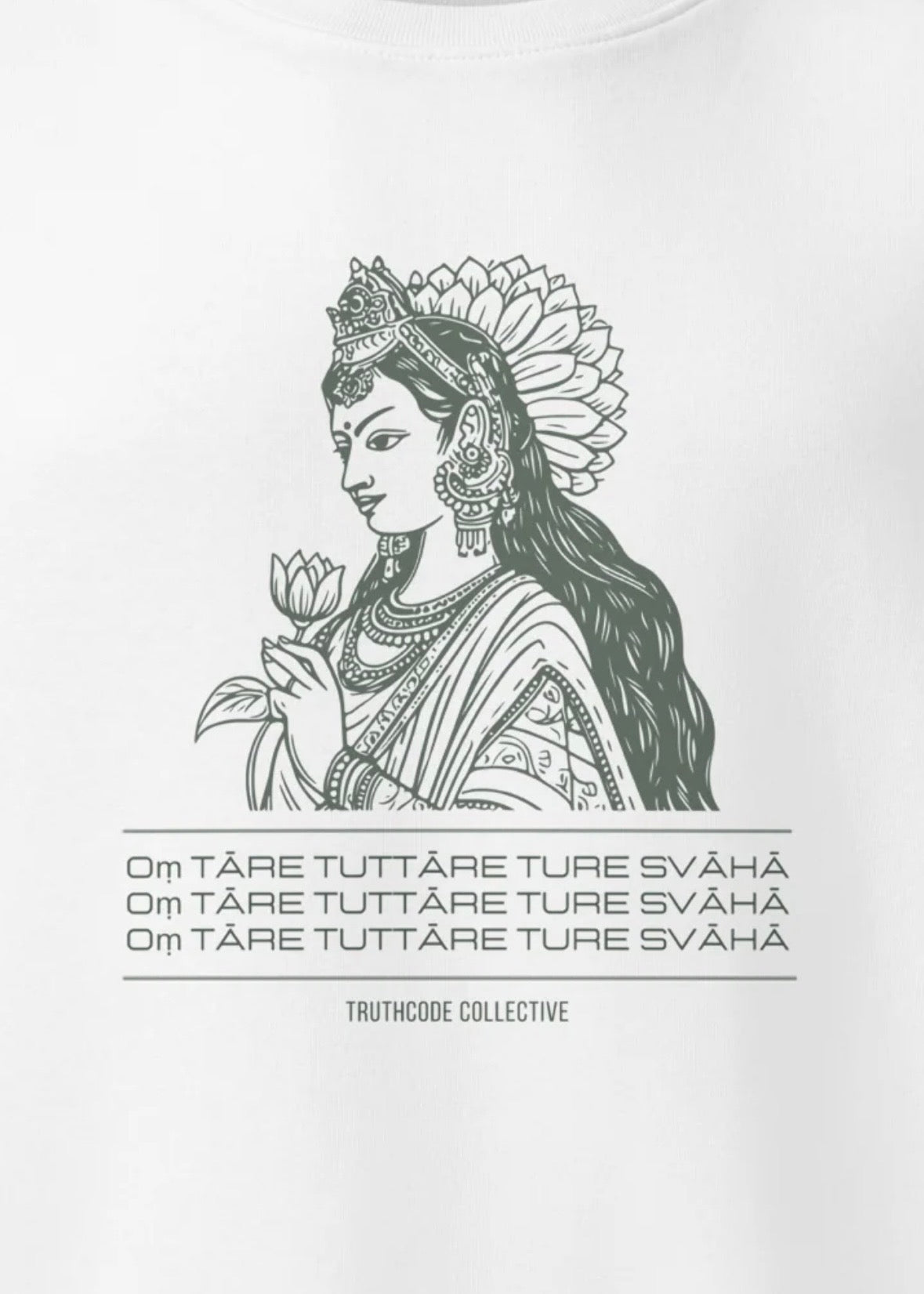 Close view of white organic sweatshirt with a graphic of a woman representing Green Tara holding a flower and mantra text, on a white background
