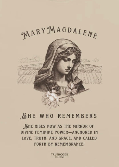 Close view of beige organic t-shirt with a graphic of Mary Magdalene and text 'She who remembers, she rises now as the mirror of the divine feminine power...',  on a white background