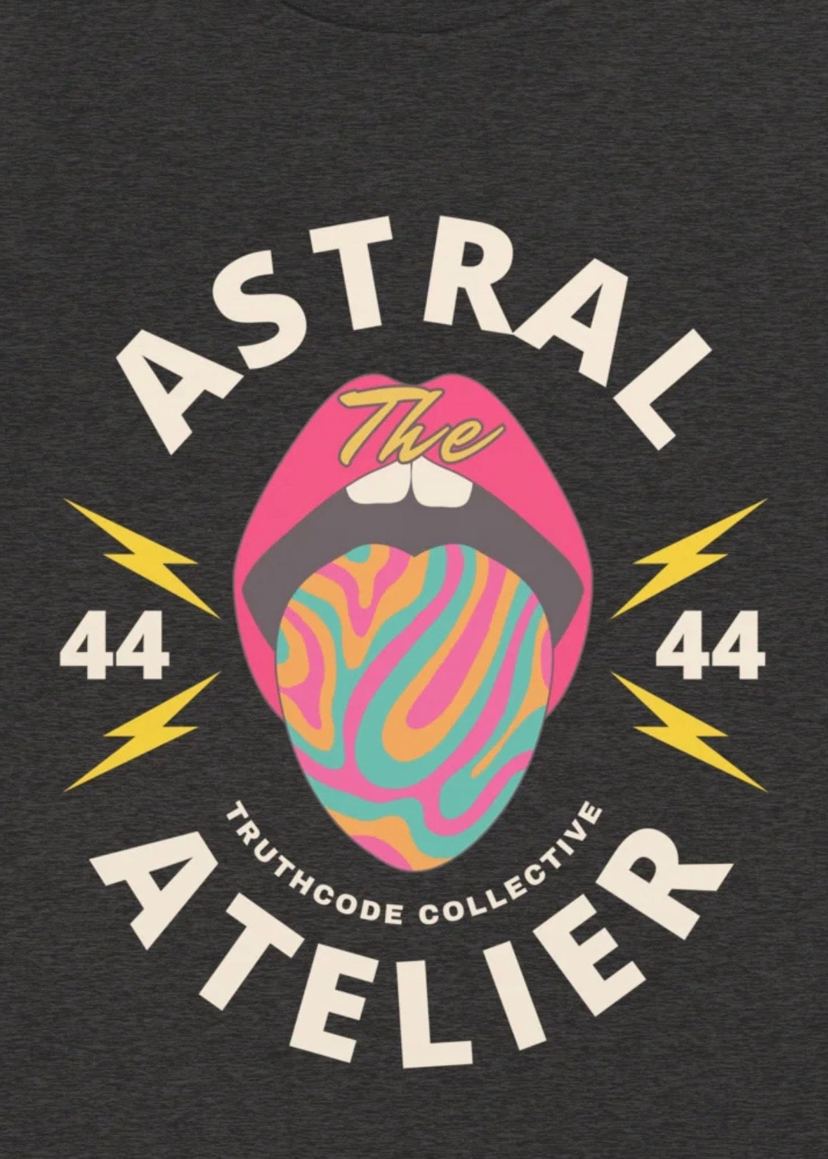 Black t-shirt with colorful graphic and text 'Astral Atelier' on a dark background