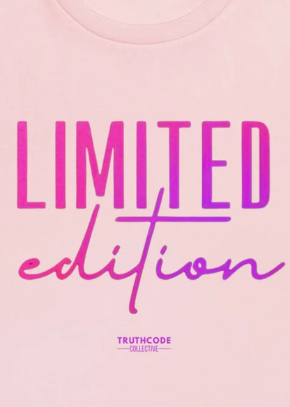 Close view of pink organic t-shirt with 'LIMITED edition' text design, on a white background