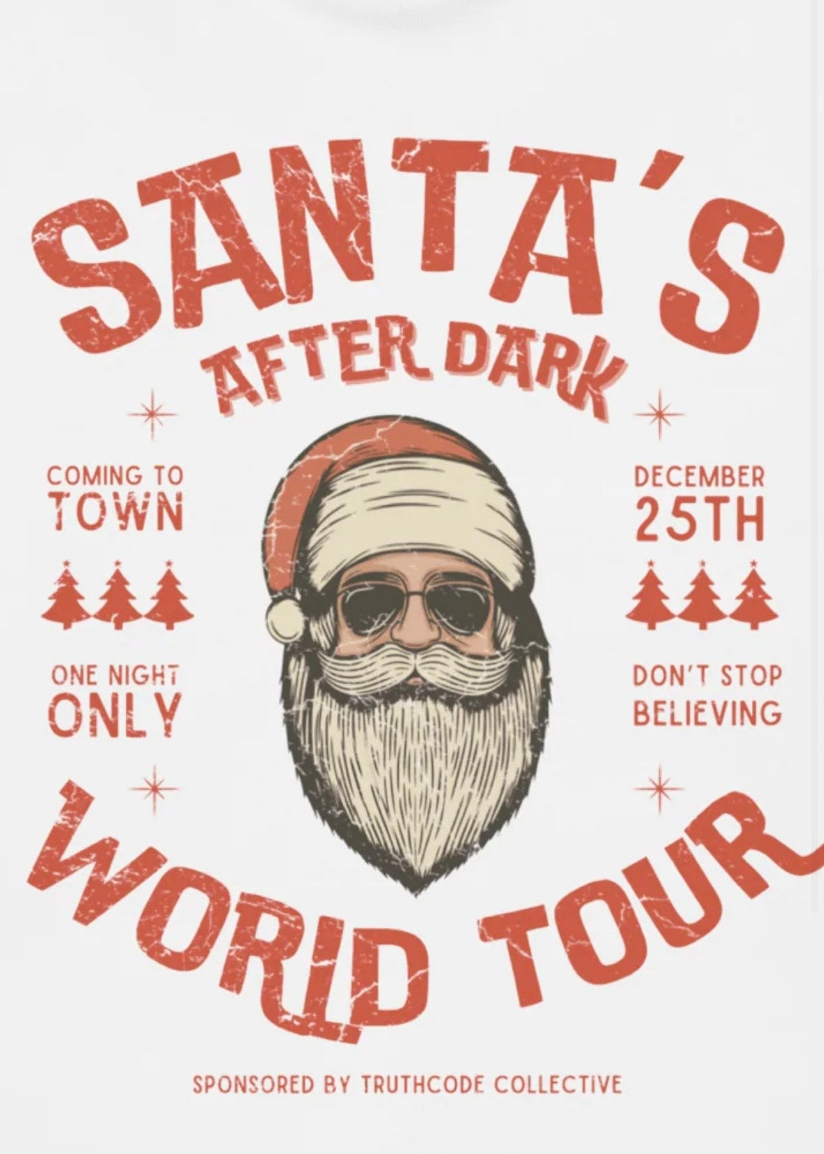 Close view of white t-shirt with text  'Santa's After Dark World Tour' with a stylized Santa Claus illustration.