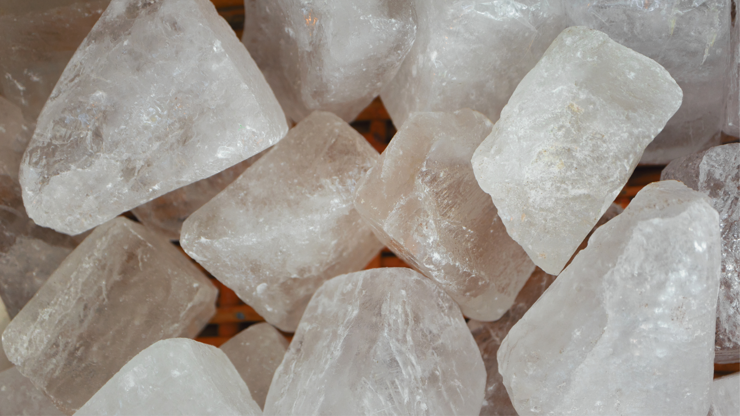 Close-up of raw crystal stones on a textured surface