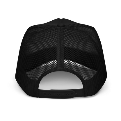 Back of a black mesh trucker hat showing adjustable snaps on a white background
