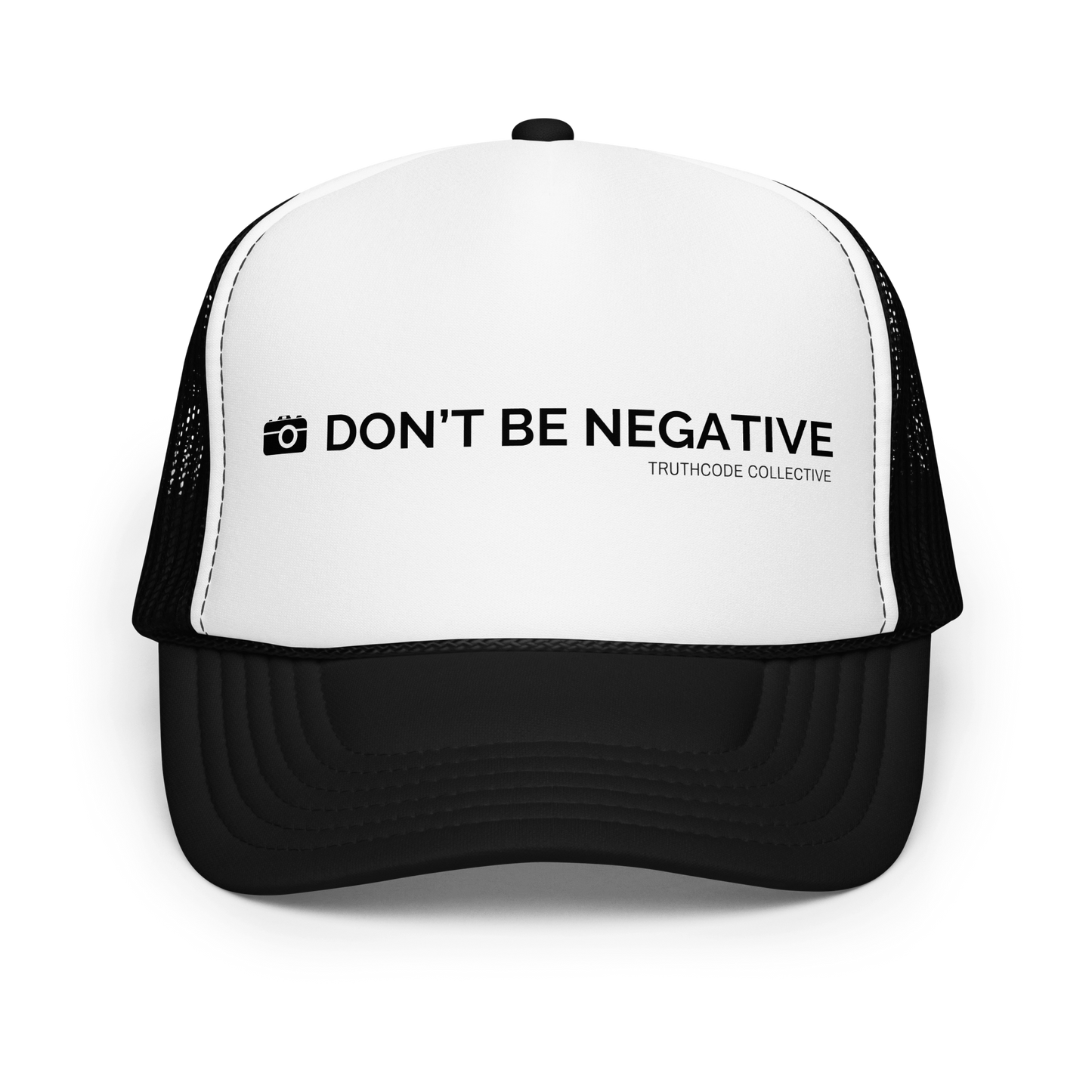 Black and white trucker hat with 'Don't Be Negative' text and camera graphic design, on a white background