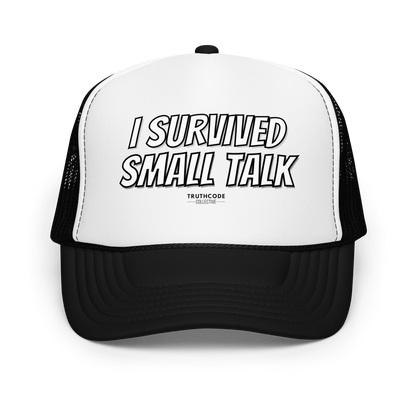 Black and white trucker hat with 'I Survived Small Talk' text on a white background