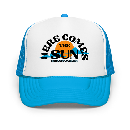 Blue and white cap with 'Here Comes the Sun' text and logo 